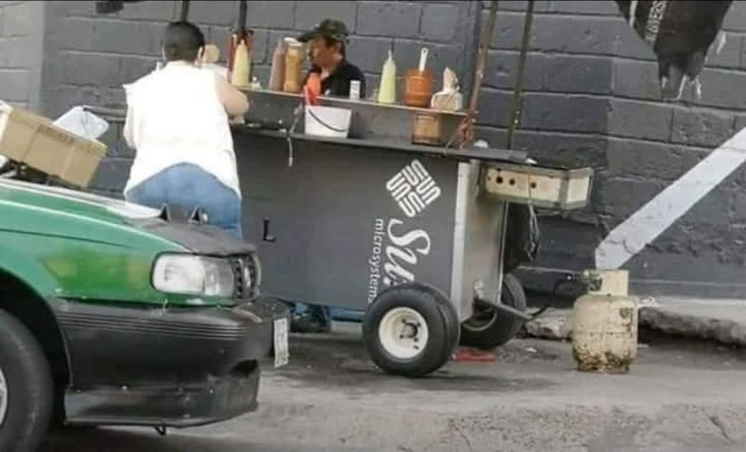 This meme features a screenshot of the popular Mexican street food cart, El Fogoncito, with a sign that reads "El Fogoncito: The Best Tacos in Town". The image is captioned "El Fogoncito: The Best Tacos in Town" with a photo of a man eating a taco, implying that the cart's sign is actually a lie. The meme is likely poking fun at the idea that a street food cart would be able to claim to be the best in town, especially if it's a small, unassuming cart.